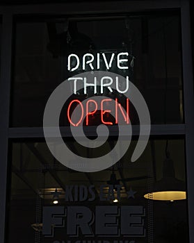 Neon Drive Thru Open Sign in Restaurant Window