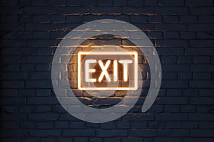 Neon EXIT sign on dark brick wall creates stark contrast, guides way out photo