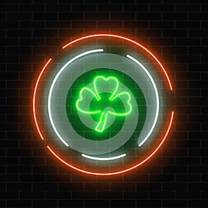 Neon glowing clover leaf sign. Green shamrock as Irish national holiday symbol in circle frames.