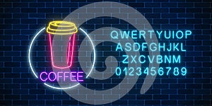 Neon glowing sign of coffee cup in circle frame with alphabet. Fastfood light billboard sign. Cafe menu item.