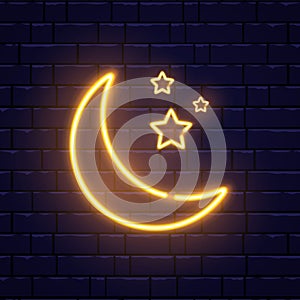 Neon golden crescent and stars. Ramadan Kareem neon sign on brick wall. Glorious month of Muslim year light banner
