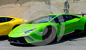 Neon green Lamborghini Performante parked on the street facing side ways.