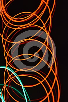 Neon green and red thin wire. Luminous wires, decoration and illumination of the surface. Electroluminescent wire, lighting object