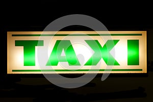 Neon green taxi sign