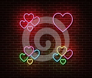 Neon heart signs vector isolated on brick wall. Love light symbol, decoration effect. Neon romantic