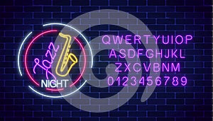 Neon jazz cafe glowing sign with saxophone and alphabet. Glowing invitation to jazz night in music bar.