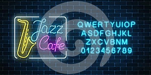 Neon jazz cafe and saxophone glowing sign with alphabet. Glowing street signboard of bar with karaoke and blues singers