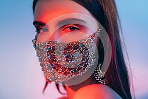 Neon light portrait pandemic fashion woman mask