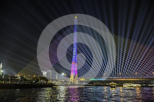 Neon lighting on Rama VIII Bridge on chao phraya river in Bangkok at night taken on dinner cruise photo