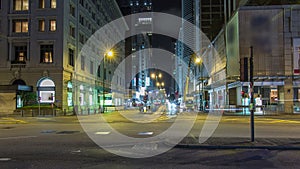 Neon lights on Tsim Sha Tsui street timelapse hyperlapse with traffic near Pehinsula. photo