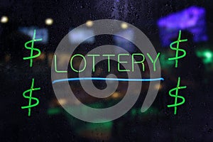 Neon Lottery Sign in Wet Rainy Window