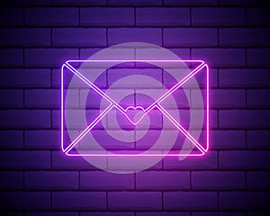 Neon love letter icon isolated on brick wall background. envelope with pink heart stamp. St. Valentine Day, mail, love