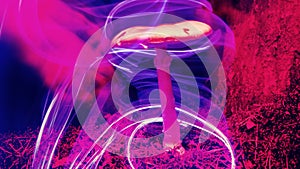 Neon magic mushroom in forest on moss