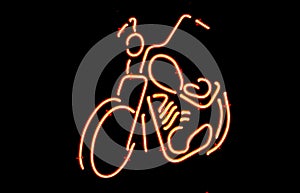 Neon motorcycle sign.