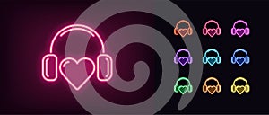 Neon music heart icon. Glowing neon heart sign with headphones, heartbeat melody