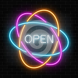 Neon open 24 hours in circle frames like planetary model sign on a dark brick wall background.