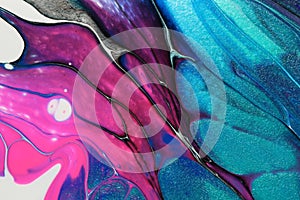 Neon pink and glitter teal work with black and white to form petals in this abstract background