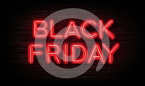 Neon red sign on a dark brick wall that says Black Friday