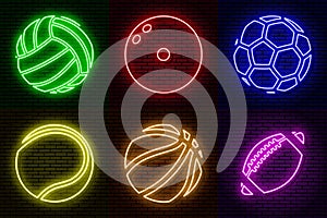 Neon sign against a brick wall. A set of different colored balls.