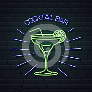 Neon sign cocktail bar on brick wall background. Vintage electric signboard