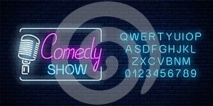 Neon sign of comedy show with retro microphone symbol with alphabet. Humor monolog stand up glowing signboard