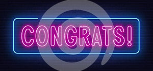 Neon sign Congrats on brick wall background.