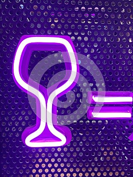 Neon sign glowing in nightclub window