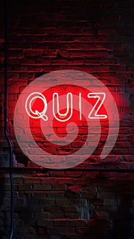 Neon sign glows red QUIZ on brick wall. Fun night. Competition. Vibrant ambiance. Entertainment. Stylish. Nightlife. Inviting. photo