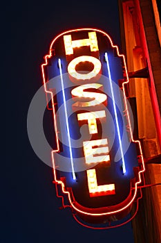 A neon sign for a hostel