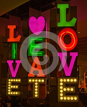 Neon sign; live, eat, love.