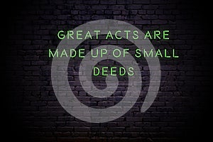 Neon sign with positive motivational saying on the wall