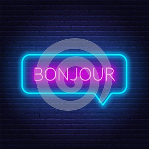 Neon sign of word bonjour in speech bubble frame on dark background. Greetings in French.