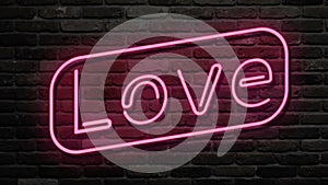 Neon sign, the word Love on dark background. Design element for Happy Valentine