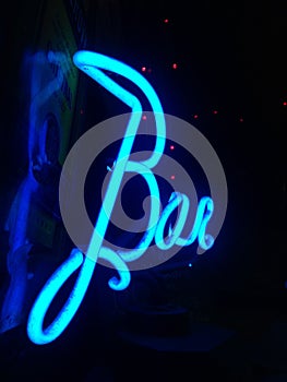 neon sign, written text Bar, on a black background