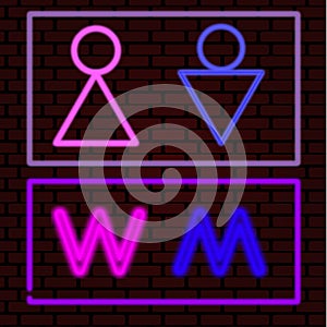 Neon signs M and W. Male and female symbols. Toilet symbols