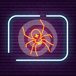 Neon spider sign arachnid logo on the wall.