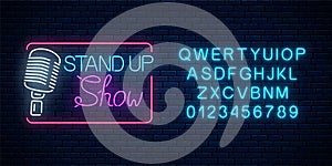 Neon stand up show sign with retro microphone. Comedy battle glowing signboard with alphabet