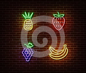 Neon vegetables fruits signs vector isolated on brick wall. Pineapple, strawberry, grape, banana lig