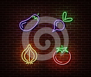 Neon vegetables signs vector isolated on brick wall. Eggplant, beetroot, onion, tomato light symbol,