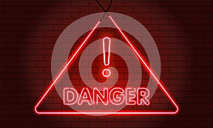 Neon word Danger Symbol Sign on Red brick wall background. Security protection, Malware, Hack Attack, Data Breach Concept. System