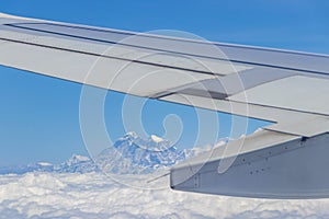 Nepal Airline aircraft wing, flight above Mount Everest in Himalaya