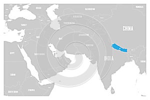 Nepal blue marked in political map of South Asia and Middle East. Simple flat vector map