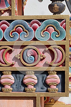 Nepal,Detail of moon and clouds ornamentation in a gold background of a tibetan buddhist stupa.