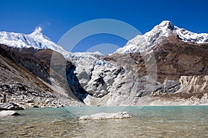 Nepal. Glacial lake at mountain Manaslu bottom