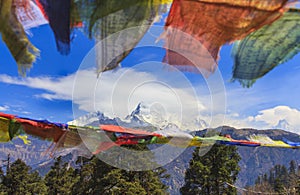 Nepal prayer flags and Annapurna mountain range, Nepal