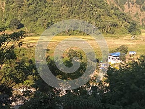 Nepalese countryside village with hill river and forest