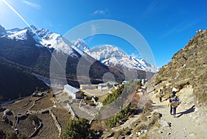 Nepalese porter (sherpa), small mountain village