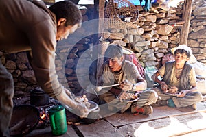 Nepalese porters eating porrige