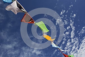 Nepalese prayer flags against the blue sky.