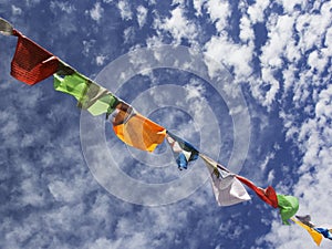 Nepalese prayer flags against the blue sky.